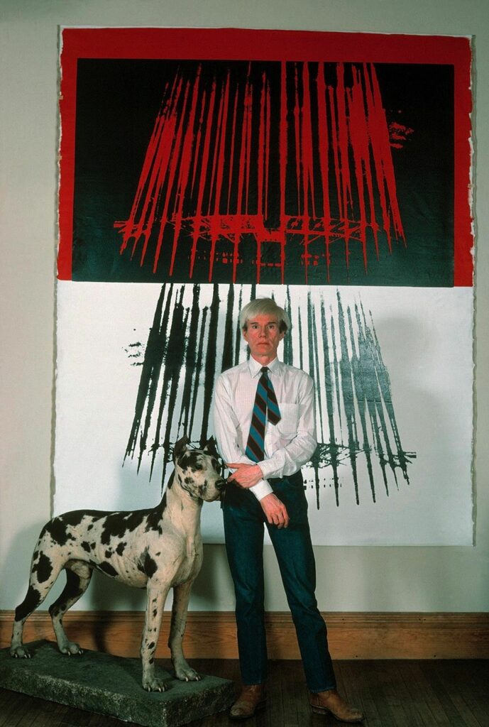 Thomas Hoepker: Andy Warhol with a great dane and light dome prints in his »Factory« at Union Square