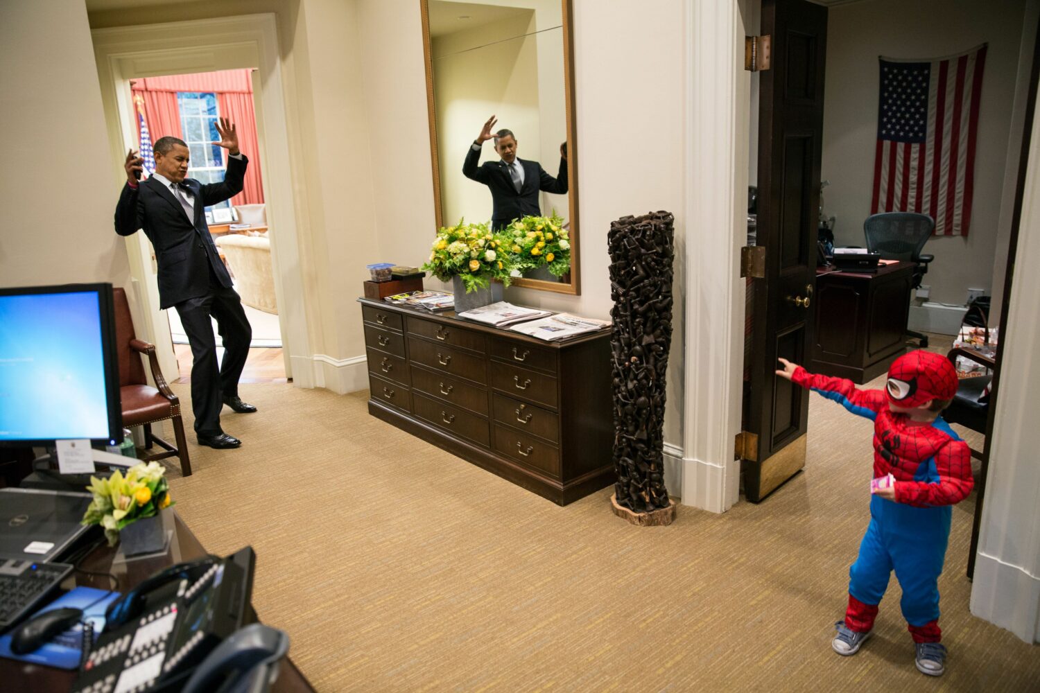 Pete Souza: Barack Obama pretends to be caught in Spider-Man’s web outside the Oval Office on Halloween