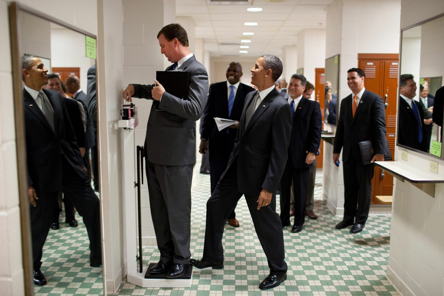 Pete Souza: Barack Obama jokingly puts his toe on the scale as Trip Director Marvin Nicholson weighs himself